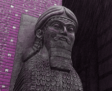 a statue of a man with a beard is standing in front of a brick wall