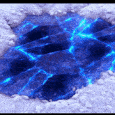 a hole in the ground filled with blue water