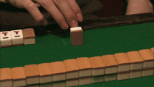 a close up of a person 's hand holding a card