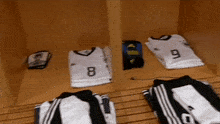 a locker filled with jerseys and socks with the number 8 and 9 on them