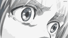 a close up of a person 's eyes with blue eyes