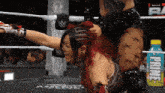 a woman in a wrestling ring with a bottle of prince in the background
