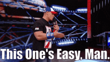 a man holding a microphone with the words " this one 's easy man " below him