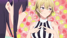 a girl in a striped top is pointing to her breast