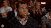 a group of people are watching a live show