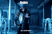 a man in a hooded costume is standing in a dark room and says " qubic get over here "
