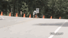 a person on a skateboard going down a road with failarmy written on the bottom