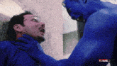 a man with glasses is being attacked by a blue monster with the word bully on the bottom right