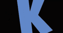 a blue letter k is surrounded by a rainbow