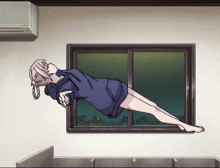 a girl in a blue hoodie is flying through the air