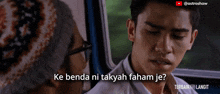 a man with glasses talks to another man with the caption ke benda ni takyah faham je