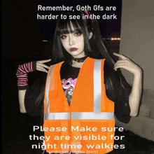 a girl wearing an orange vest with a caption that says goth gfs are harder to see in the dark