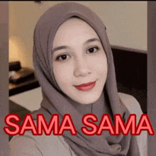 a woman wearing a hijab is taking a selfie with the caption sama sama