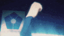 a person 's fist is raised in the air in front of a building with a pentagon on it