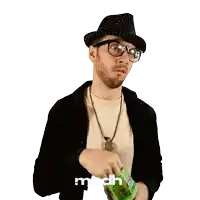 a man wearing a hat and glasses is holding a bag of mcdh candy