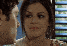 a man and a woman are looking into each others eyes