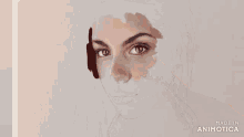 a person is painting a woman 's face with a brush and made in animatica