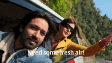 a man and a woman looking out of a car window with the words need some fresh air below them