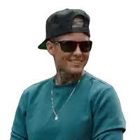 a woman wearing sunglasses and a hat has a tattoo on her neck