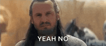a man with long hair and a beard is making a face and saying yeah no .