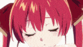 a close up of a girl 's face with red hair
