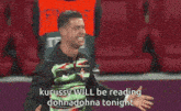 a man in a striped shirt is laughing and says kurussy will be reading dohmadonna tonight
