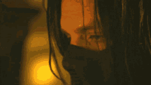 a close up of a person wearing a black mask
