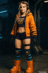 a woman wearing a punk 06 shirt is standing in a room