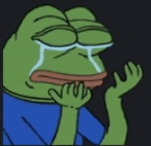 a cartoon frog is crying with his eyes closed and a tear coming out of his mouth .