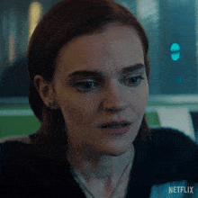 a close up of a woman 's face with the word netflix on the bottom