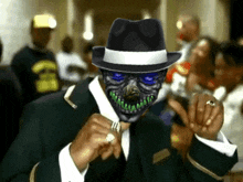 a man with a mask on his face is wearing a black hat