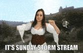 a woman in a medieval dress says it 's sunday storm stream in the background