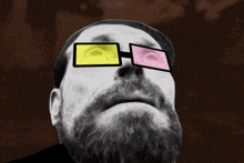 a man with a beard wearing a pair of glasses