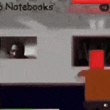a blurred image of a laptop with the word notebooks on the top