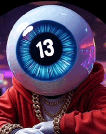 a man wearing a red hoodie has a ball with the number 13 in it