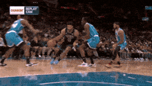 a basketball game is being played in front of a dunkin donuts banner