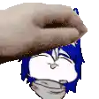 a hand is holding a cartoon character 's head with a blue hair .