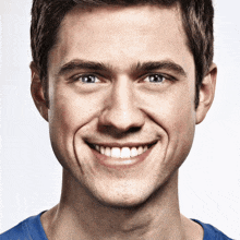a close up of a man 's face smiling