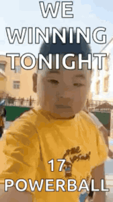 a young boy in a yellow shirt is taking a selfie with the words `` we winning tonight '' .