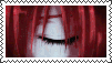 a close up of a woman 's face with red hair and closed eyes .