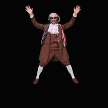 a man in a benjamins costume is jumping in the air with his arms in the air