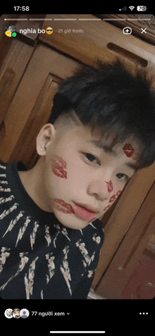 a screenshot of a young man 's face with lipstick on his face