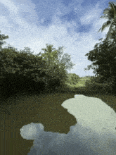 a large body of water surrounded by trees with a blue sky in the background