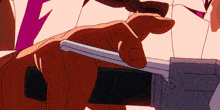 a close up of a person holding a knife in their hand