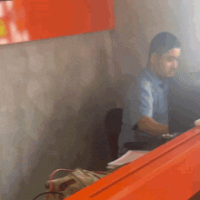 a blurry picture of a man sitting at a table