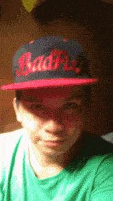 a man wearing a hat that says badfu