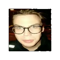 a man wearing glasses and a black shirt is looking at the camera