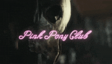 a pink neon sign with a horse and the words pink pony club on it
