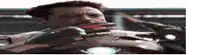 a man in an iron man suit is holding a gun in his mouth