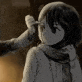 a person is pointing at a girl 's face in a black and white photo .